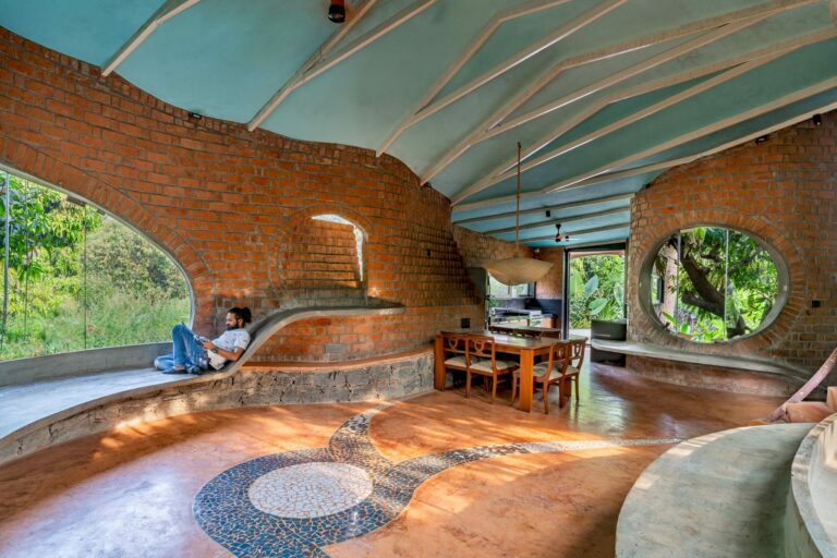 Biophilic Farmhouse, Wrapped Around a Small Mango Grove