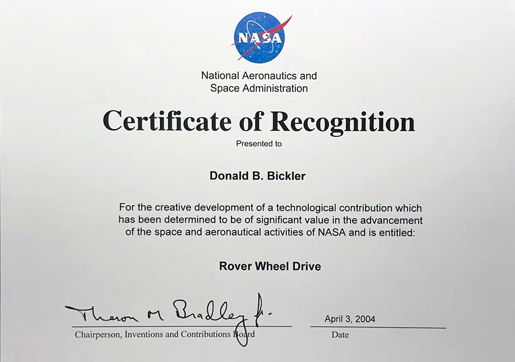 Center-aligned certificate of recognition featuring the "meatball" logo and not-quite-centered heading for "Rover Wheel Drive". April 2004